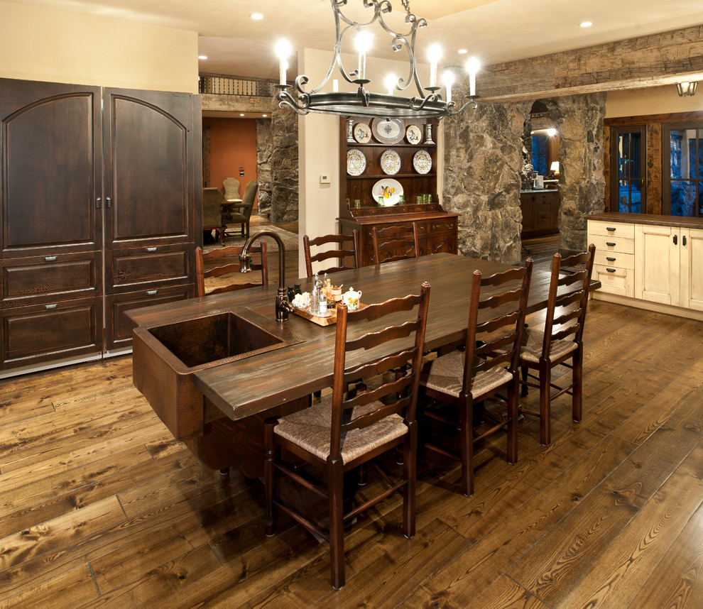 Design ideas for a country kitchen/dining combo in Denver with white walls and medium hardwood floors.