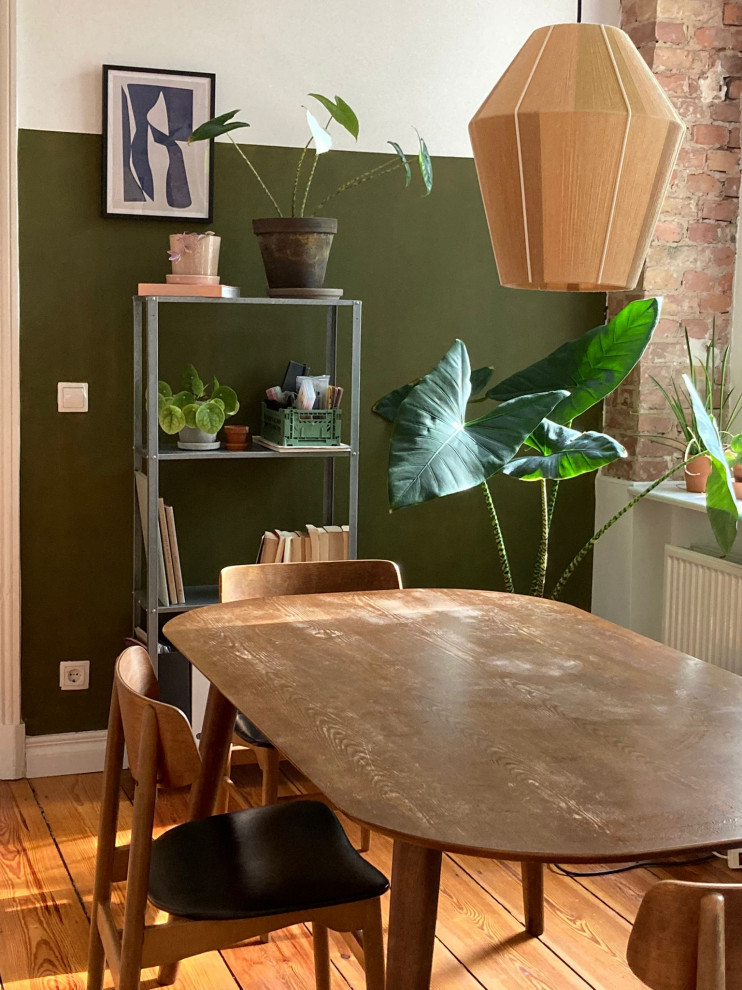 Immagine di un piccolo soggiorno contemporaneo aperto con pareti verdi