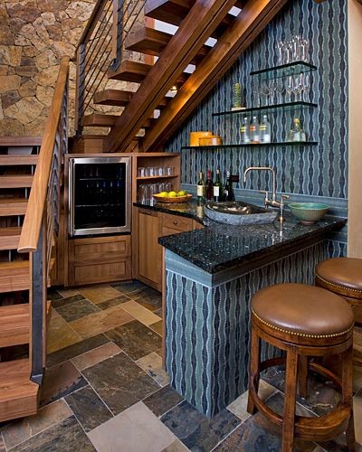 Inspiration for a small country l-shaped seated home bar in New York with shaker cabinets, medium wood cabinets, granite benchtops, blue splashback and slate floors.
