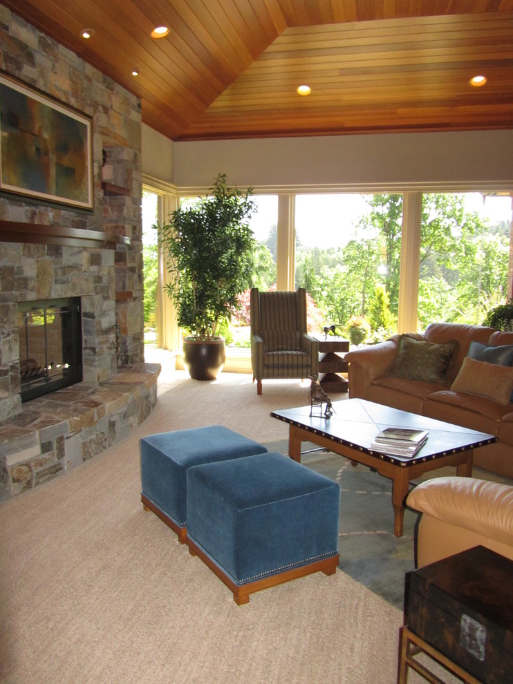 This is an example of a large traditional formal open concept living room in Portland with beige walls, carpet, a standard fireplace, a stone fireplace surround and no tv.