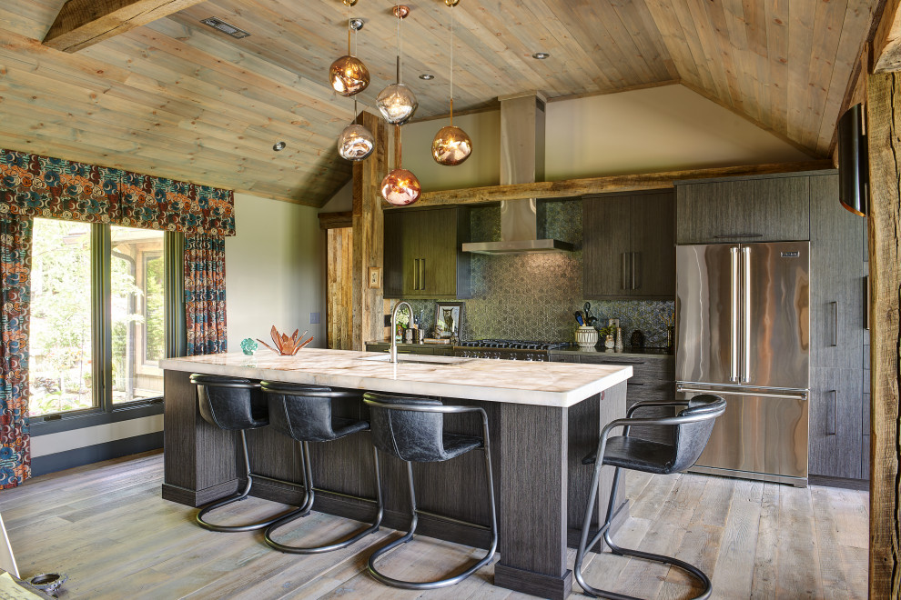 Example of a mountain style u-shaped light wood floor, beige floor and wood ceiling eat-in kitchen design with an undermount sink, flat-panel cabinets, dark wood cabinets, granite countertops, gray backsplash, glass tile backsplash, stainless steel appliances, an island and white countertops