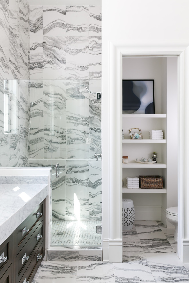 Mistflower - Alcove shower - mid-sized transitional master white tile and porcelain tile porcelain tile and white floor alcove shower idea in Louisville with beaded inset cabinets, dark wood cabinets, a two-piece toilet, white walls, an undermount sink, marble countertops and a hinged shower door