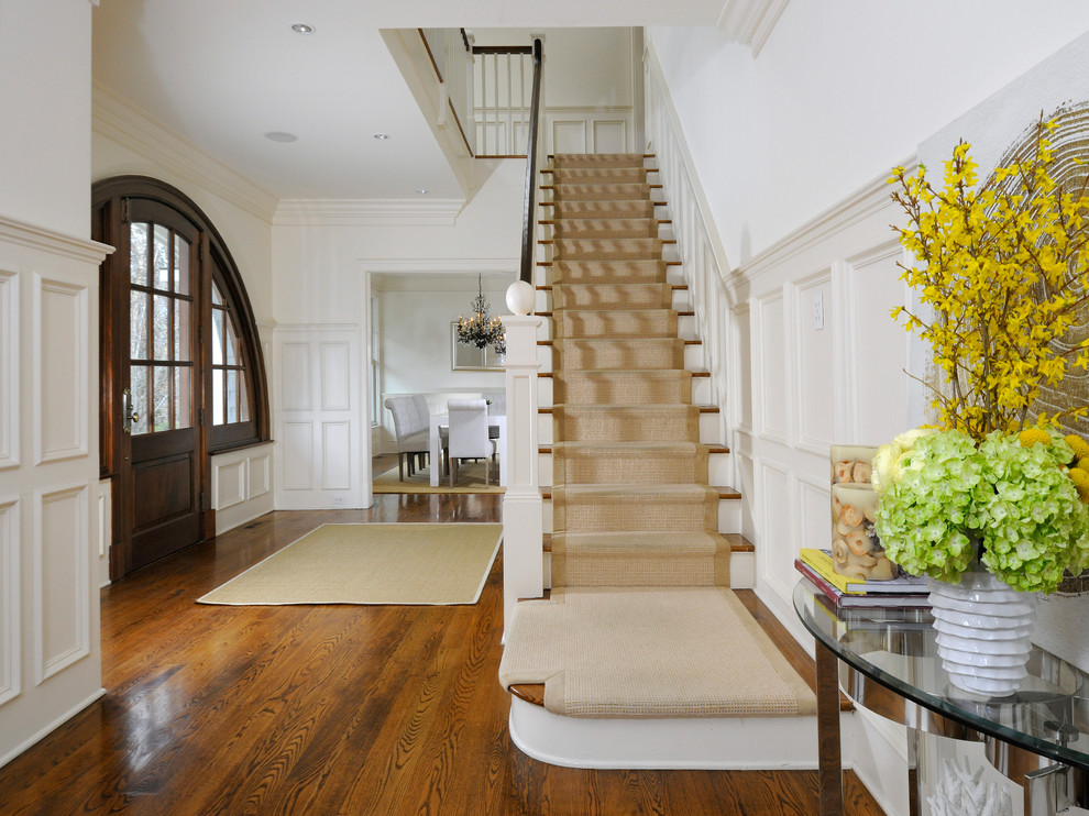This is an example of a traditional wood straight staircase in New York with wood risers and wood railing.