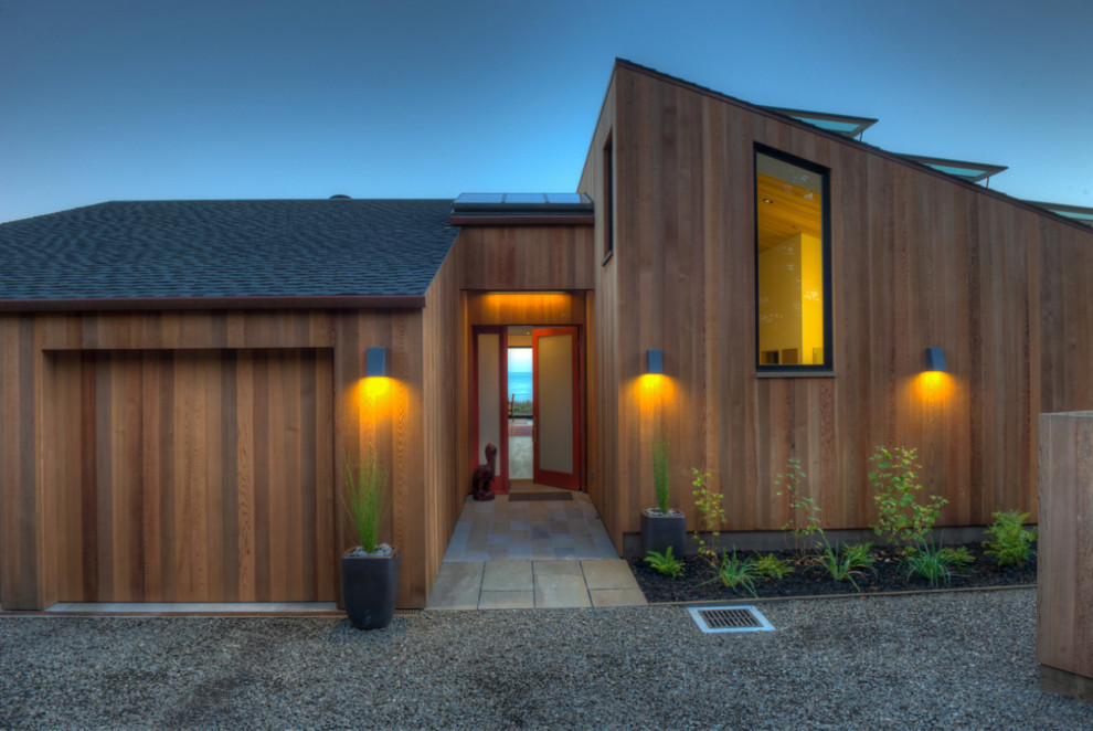 Inspiration for a mid-sized modern brown one-story wood house exterior remodel in San Francisco with a clipped gable roof and a shingle roof