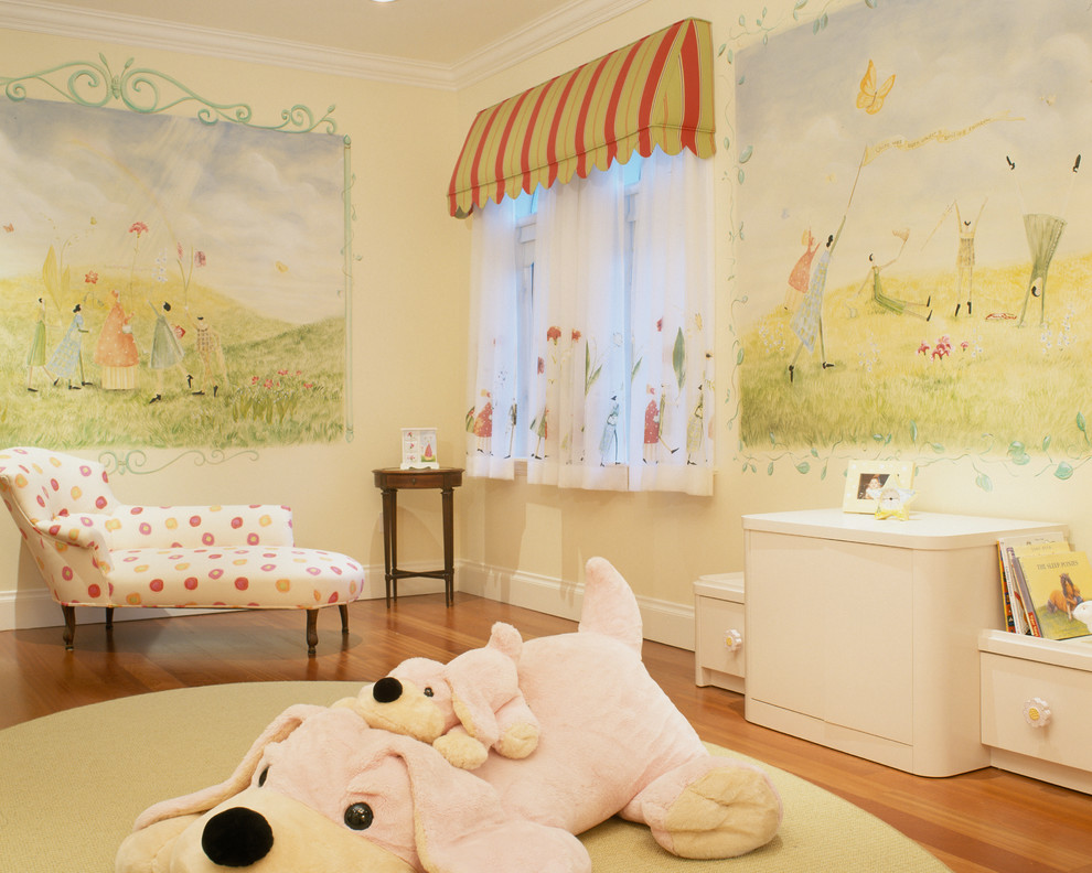 This is an example of a traditional kids' playroom for girls in Miami with medium hardwood floors.