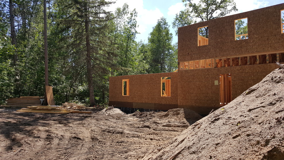 Example of a mountain style concrete fiberboard multicolored home design design in Minneapolis