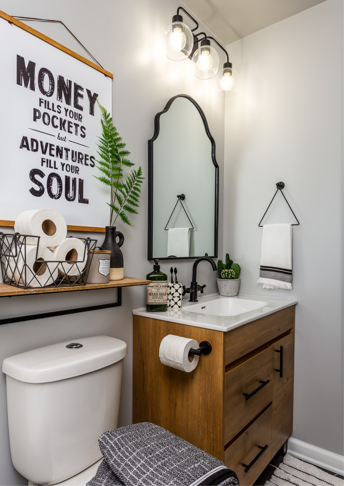This is an example of a mid-sized midcentury bathroom in Chicago with medium wood cabinets, an alcove tub, a shower/bathtub combo, a two-piece toilet, white tile, porcelain tile, grey walls, porcelain floors, a drop-in sink, grey floor and a shower curtain.