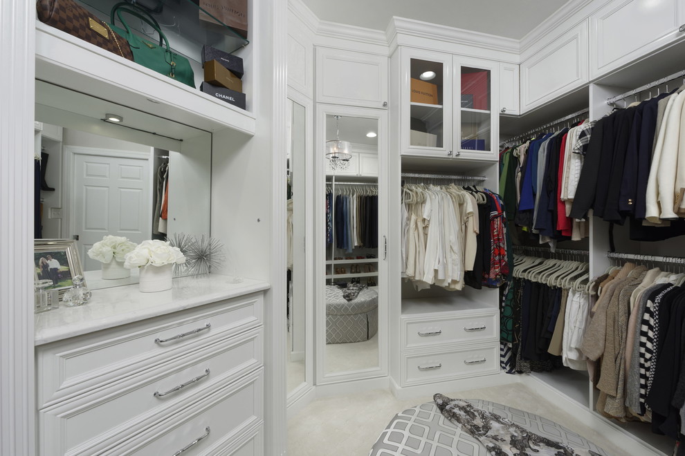 Inspiration for a mid-sized transitional women's dressing room in DC Metro with recessed-panel cabinets, white cabinets, carpet and beige floor.