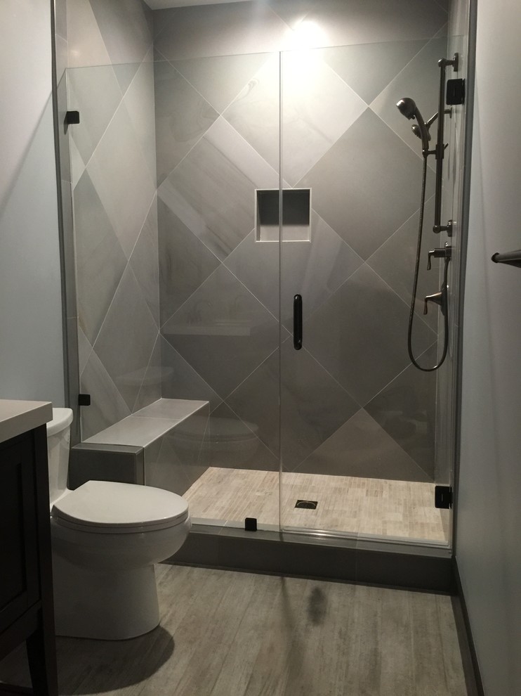 Example of a transitional gray tile alcove shower design in Orange County