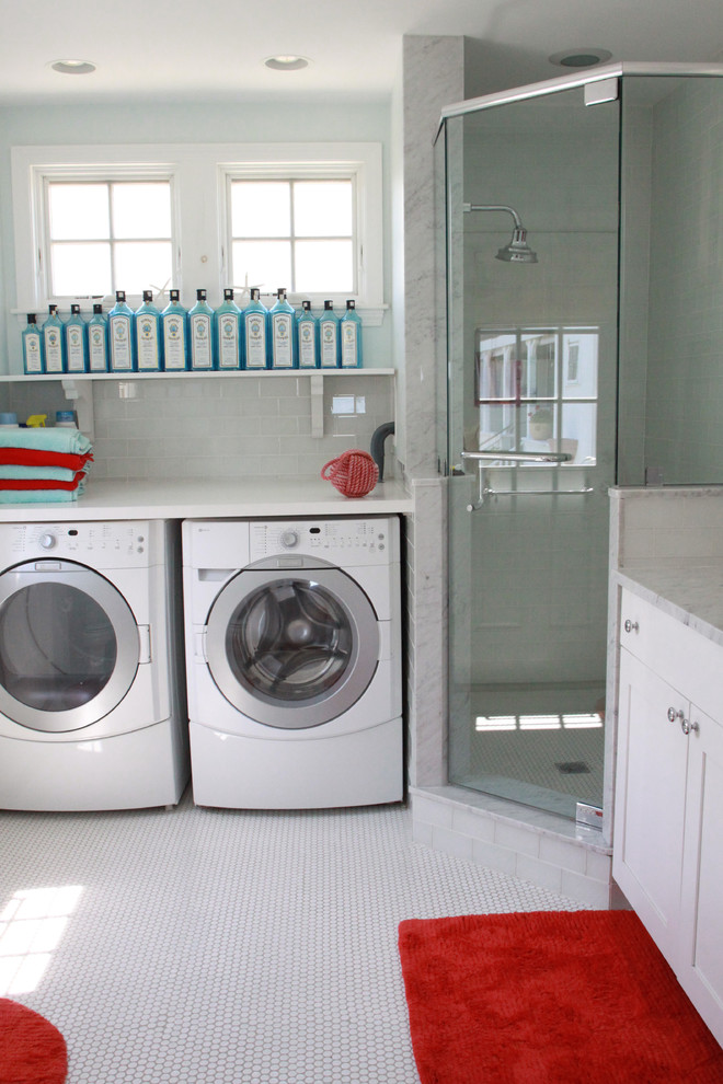 Photo of a large beach style l-shaped utility room in Boston with an undermount sink, shaker cabinets, white cabinets, marble benchtops, blue walls, ceramic floors, a side-by-side washer and dryer, yellow floor and white benchtop.