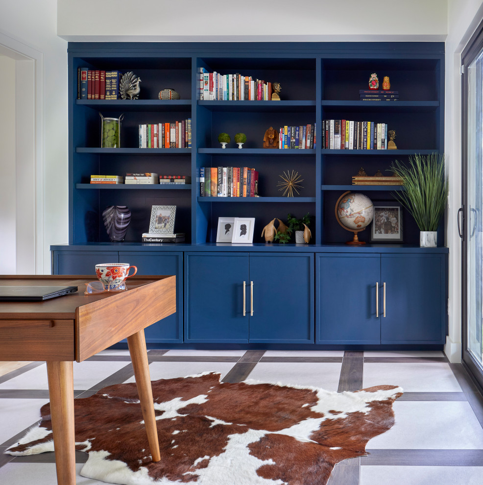 This is an example of a mid-sized scandinavian home office in Denver with white walls, porcelain floors, a freestanding desk and multi-coloured floor.