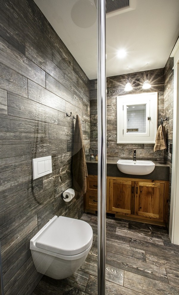 Inspiration for a small country master bathroom in Chicago with a drop-in sink, flat-panel cabinets, medium wood cabinets, a curbless shower, a wall-mount toilet and dark hardwood floors.