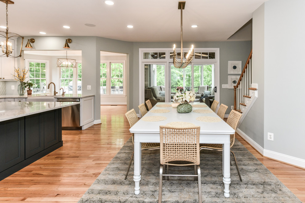 Transitional light wood floor and beige floor great room photo in DC Metro with gray walls