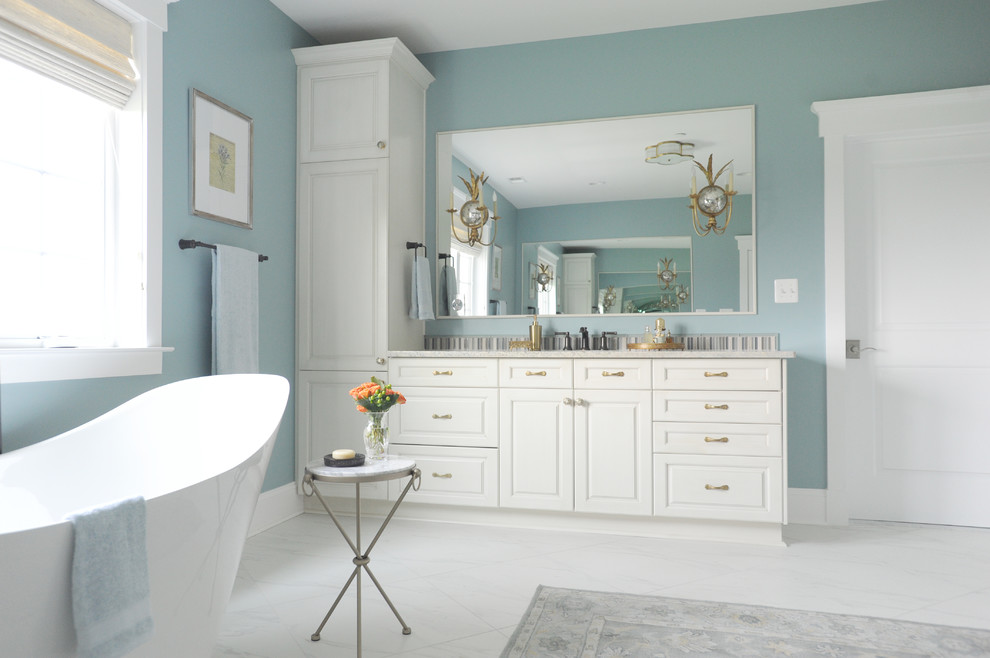 Inspiration for a large transitional master bathroom in Baltimore with raised-panel cabinets, white cabinets, a freestanding tub, ceramic tile, blue walls, ceramic floors, quartzite benchtops, white floor and white benchtops.