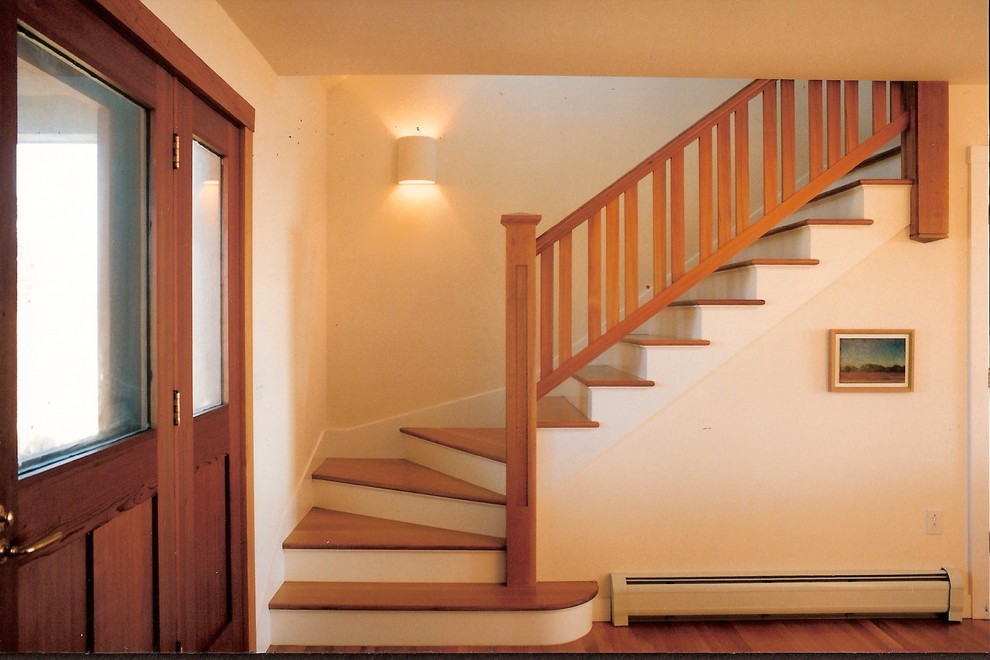 Design ideas for a small beach style wood l-shaped staircase in Boston with wood risers.