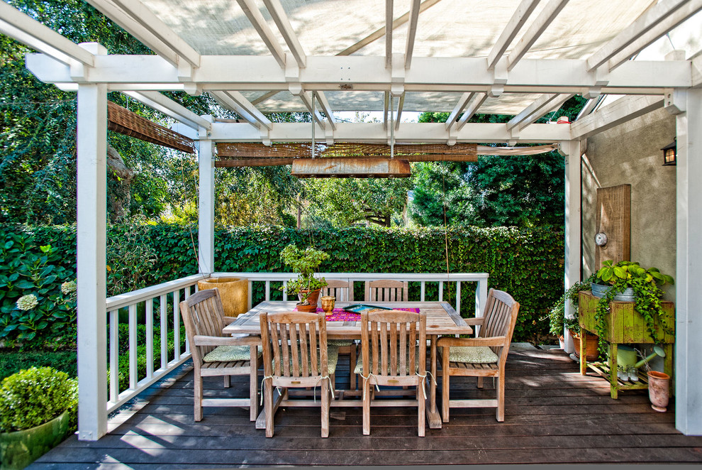 Inspiration for a traditional deck in Los Angeles with a pergola.