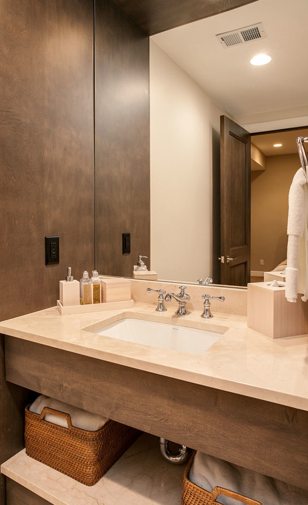 Inspiration for a mid-sized transitional powder room in Denver with flat-panel cabinets, white cabinets, brown walls, an undermount sink, engineered quartz benchtops and beige benchtops.
