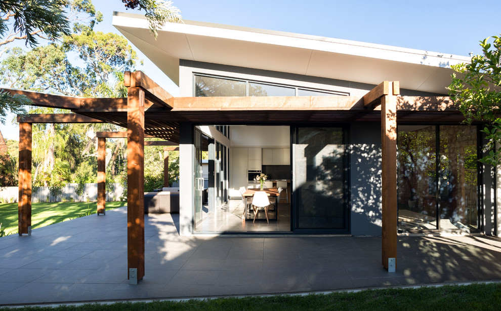 Inspiration for a large contemporary backyard verandah in Adelaide with tile and a pergola.