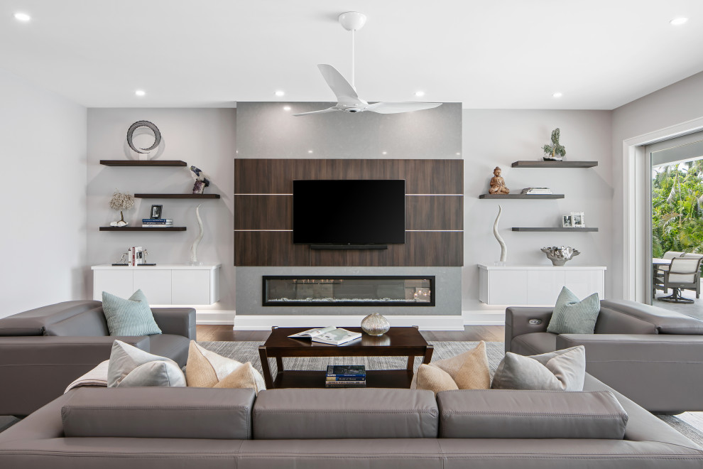 This is an example of a contemporary family room in Tampa.