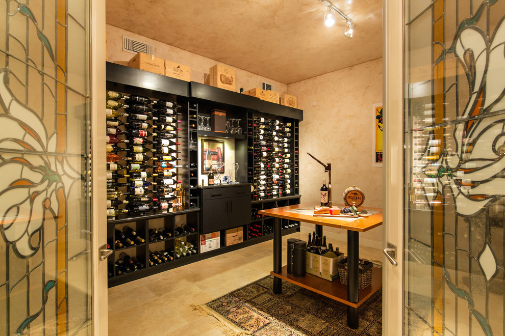 This is an example of a large modern wine cellar in San Diego with ceramic floors, display racks and yellow floor.