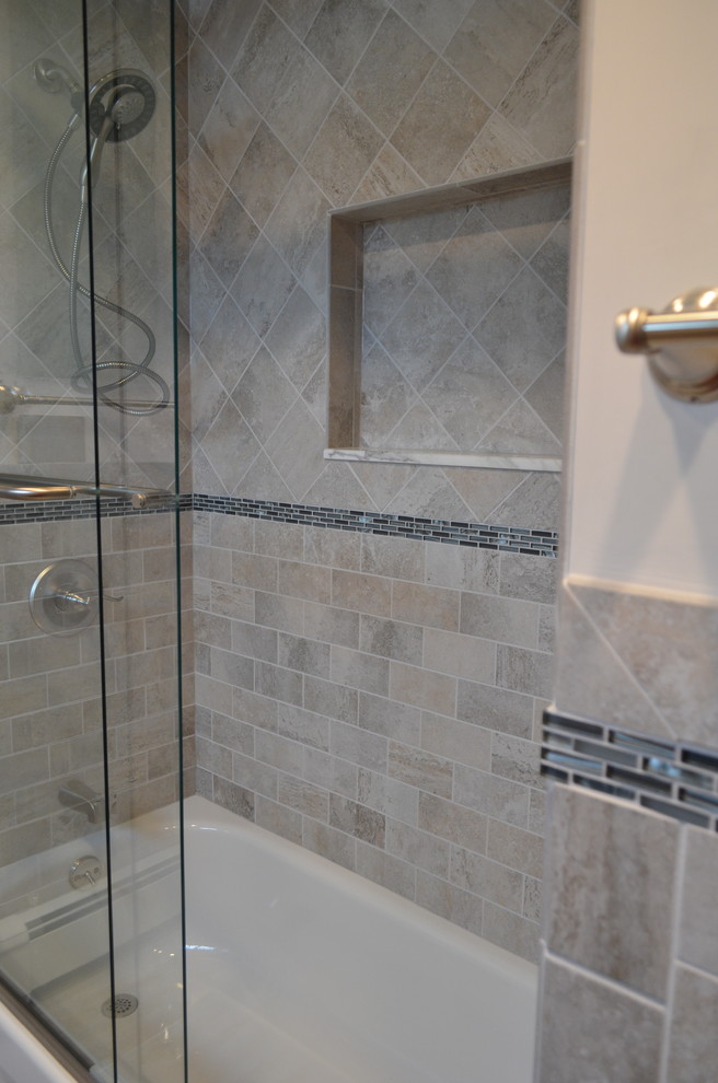 Alcove shower - transitional kids' porcelain tile alcove shower idea in New York