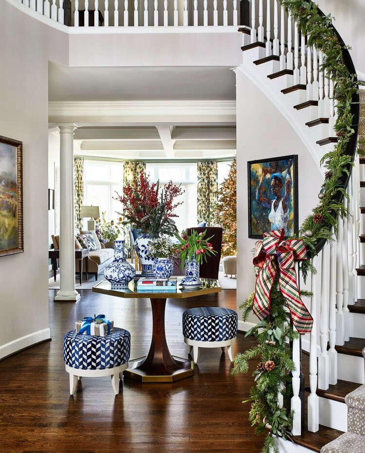 Mid-sized trendy medium tone wood floor hallway photo in Tampa with white walls