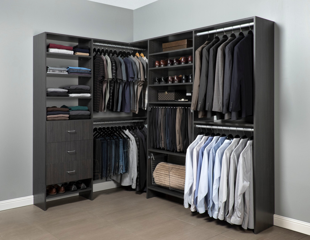 This is an example of a mid-sized modern dressing room in Toronto with flat-panel cabinets and grey cabinets.