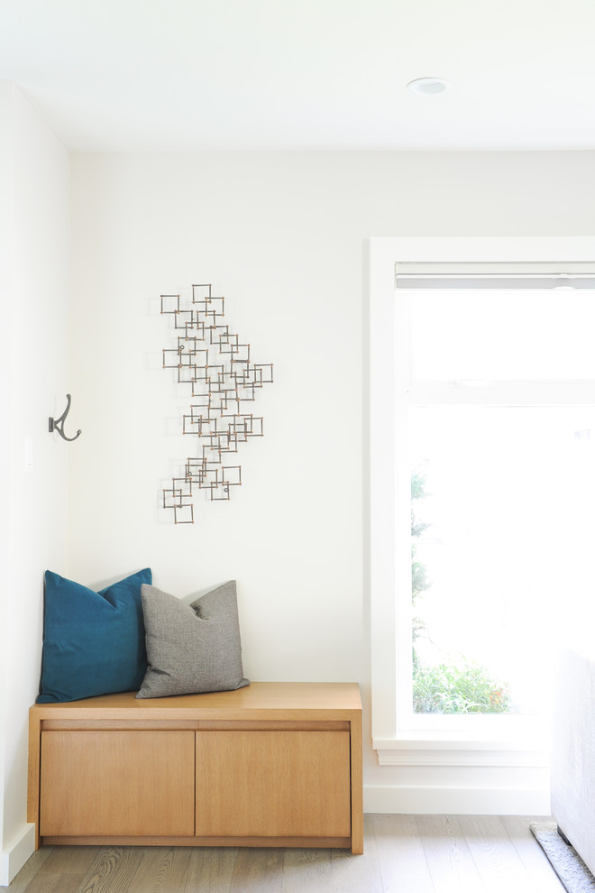 Inspiration for a transitional mudroom remodel in Vancouver with white walls