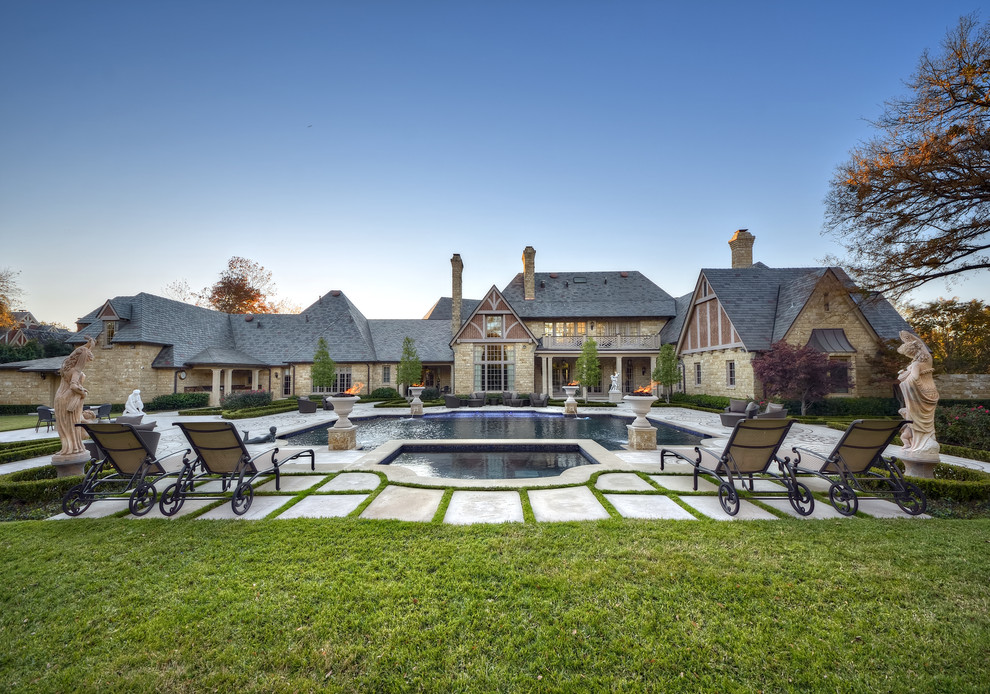 This is an example of a large traditional courtyard custom-shaped pool in Dallas.