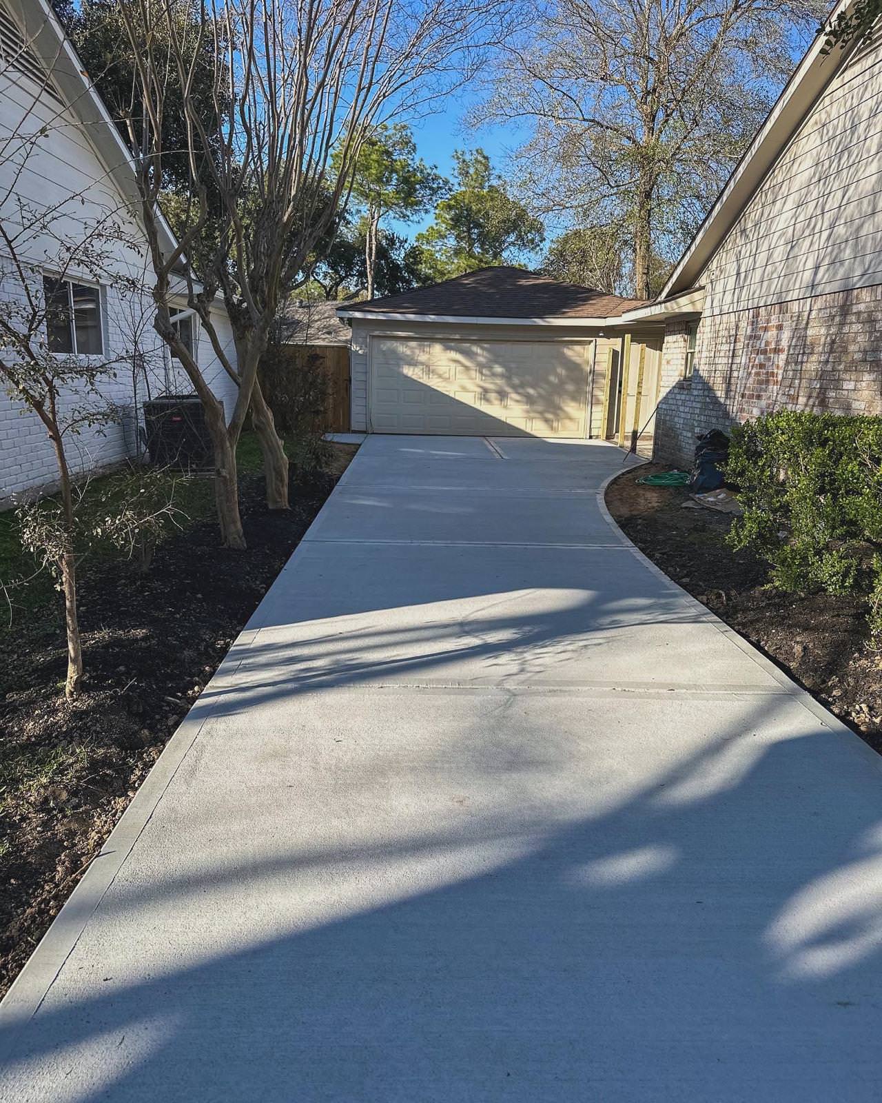 New driveway with sidewalks and stamped concrete!