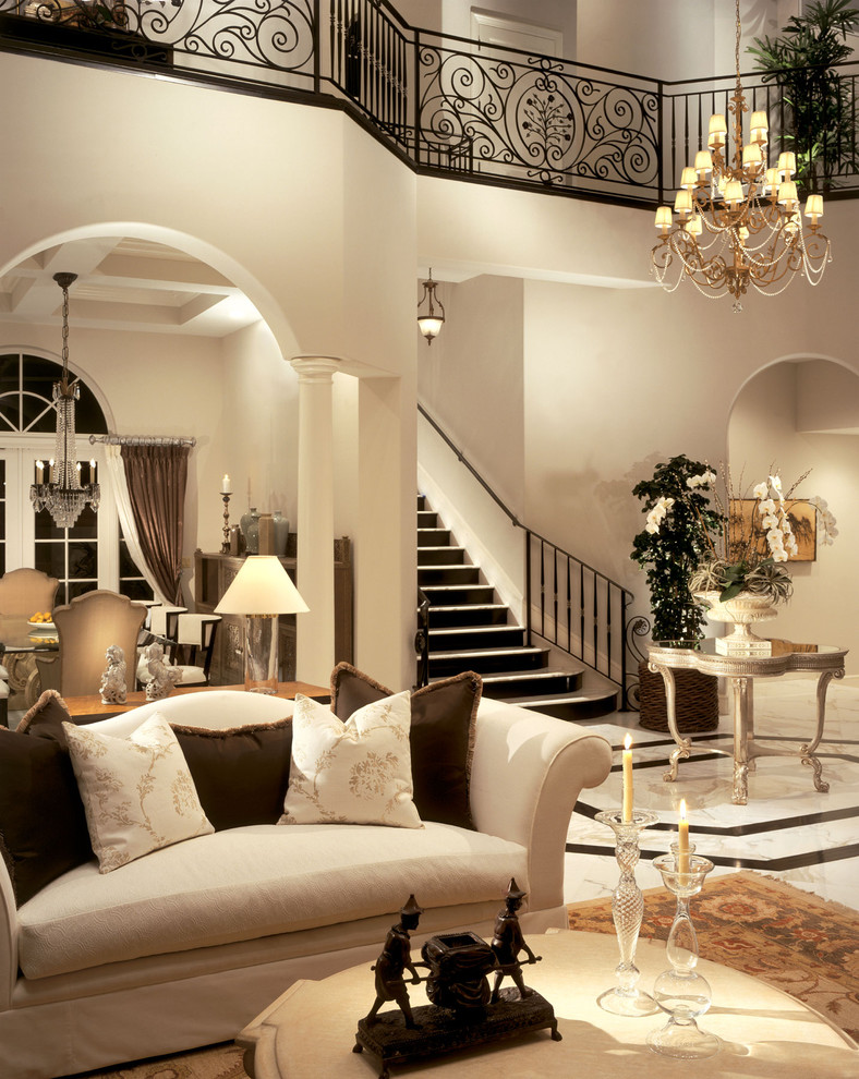 This is an example of a traditional living room in Miami with marble floors.