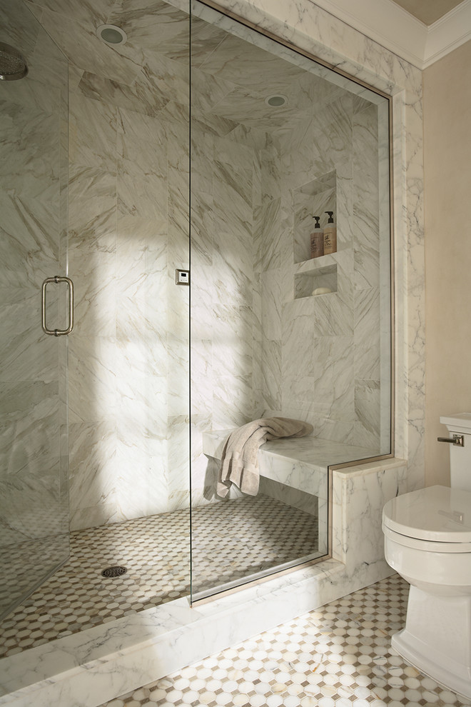 Photo of a traditional bathroom in Minneapolis with marble benchtops, an alcove shower, a one-piece toilet, beige tile, white tile and mosaic tile.