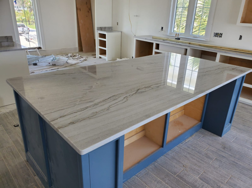 Design ideas for a large u-shaped eat-in kitchen in Other with blue cabinets, quartzite benchtops, with island, grey floor and multi-coloured benchtop.