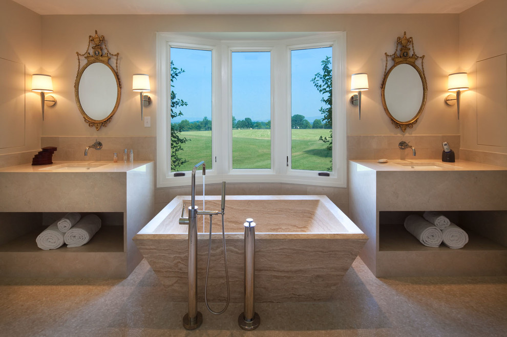 Inspiration for a large transitional master bathroom in Richmond with a freestanding tub, flat-panel cabinets, beige cabinets, beige tile, ceramic tile, beige walls, an undermount sink and beige floor.