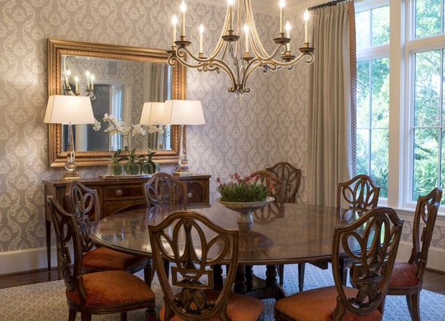 This is an example of a large traditional kitchen/dining combo in Charleston with grey walls and dark hardwood floors.
