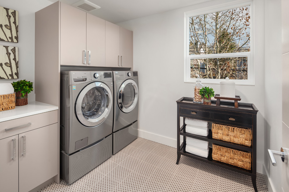 Inspiration for a mid-sized contemporary single-wall dedicated laundry room in Seattle with porcelain floors and a side-by-side washer and dryer.