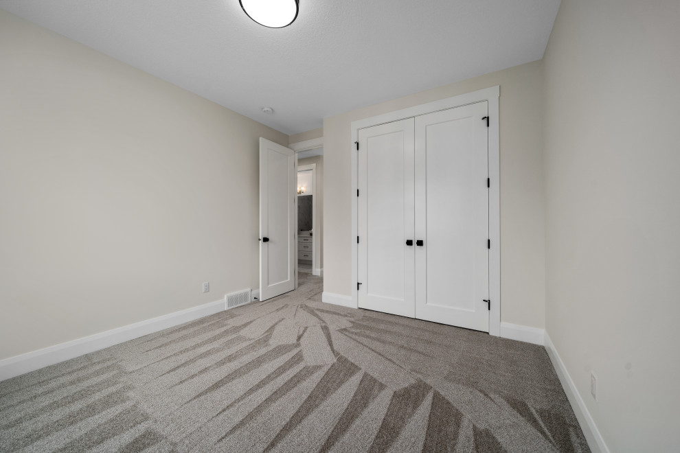 Transitional home design photo in Calgary