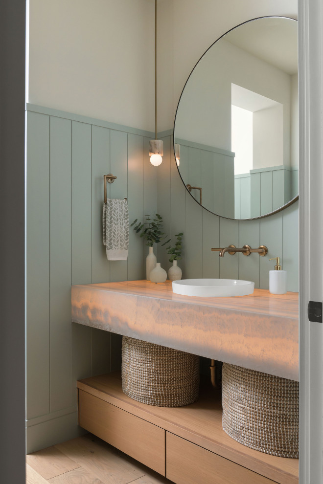This is an example of a classic cloakroom in San Diego with flat-panel cabinets, light wood cabinets, blue walls, a built-in sink, beige floors, beige worktops, a floating vanity unit, tongue and groove walls and wainscoting.