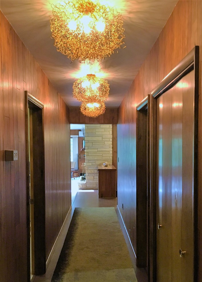 Design ideas for a mid-sized midcentury hallway in Other with cork floors.