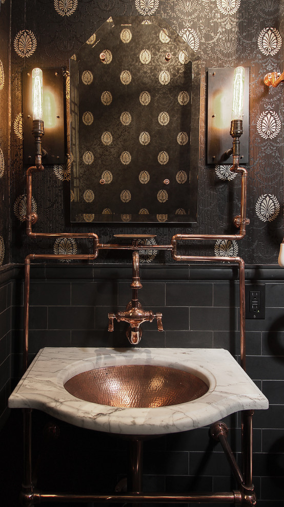 Design ideas for an industrial powder room in San Francisco with black walls.