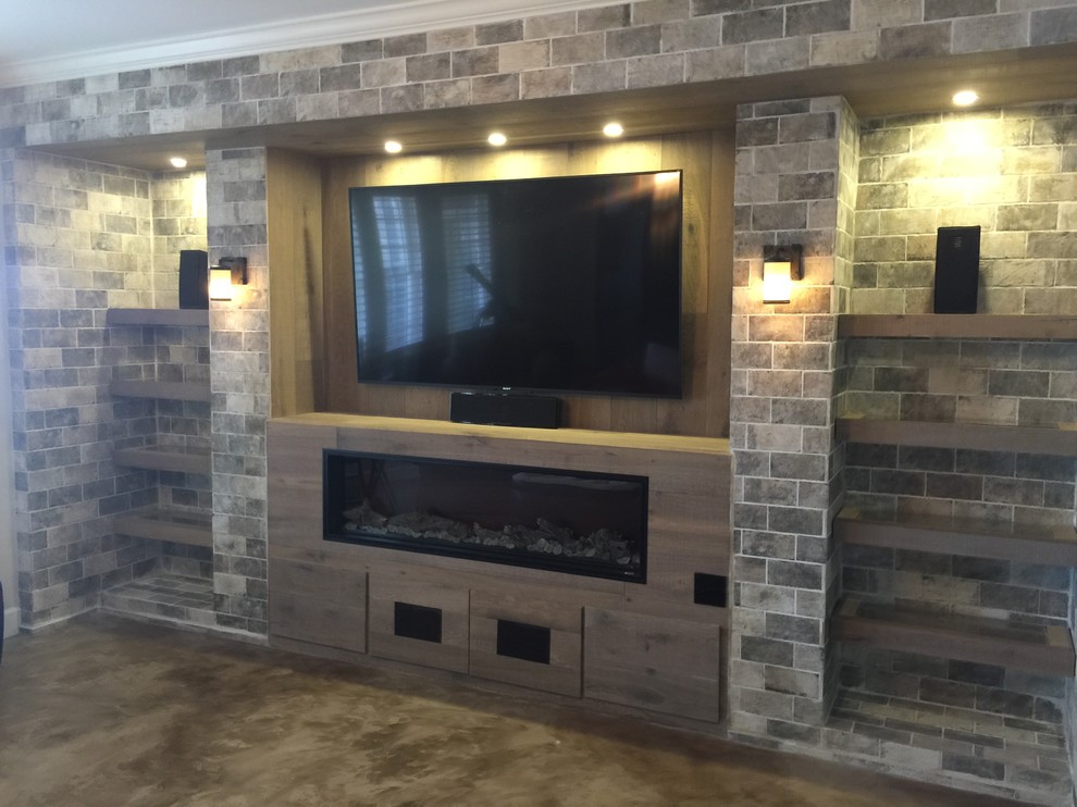 Photo of a traditional home theatre in Atlanta with beige walls, concrete floors and beige floor.