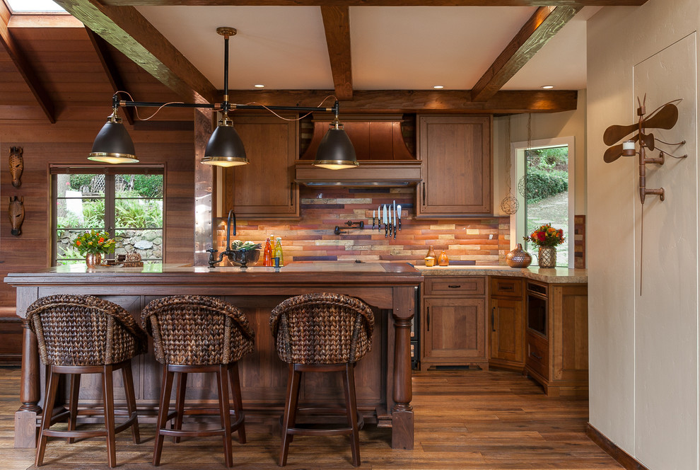 Inspiration for a mid-sized country galley kitchen in San Francisco with shaker cabinets, dark wood cabinets, dark hardwood floors, with island, slate splashback and granite benchtops.