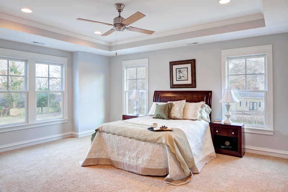 Photo of a mid-sized arts and crafts master bedroom in Raleigh with grey walls, carpet, no fireplace and beige floor.