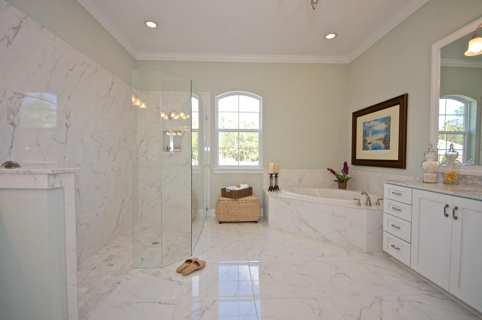 Large traditional master bathroom in Jacksonville with shaker cabinets, white cabinets, a corner tub, a curbless shower, gray tile, white tile, marble, green walls, marble floors, an undermount sink and marble benchtops.