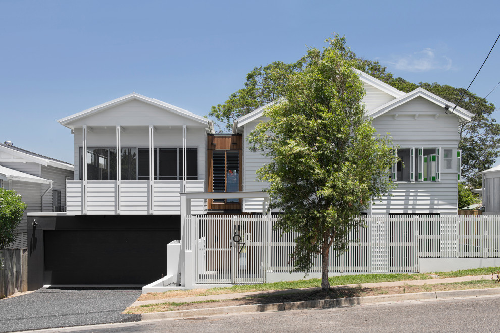 Photo of a beach style home design in Brisbane.