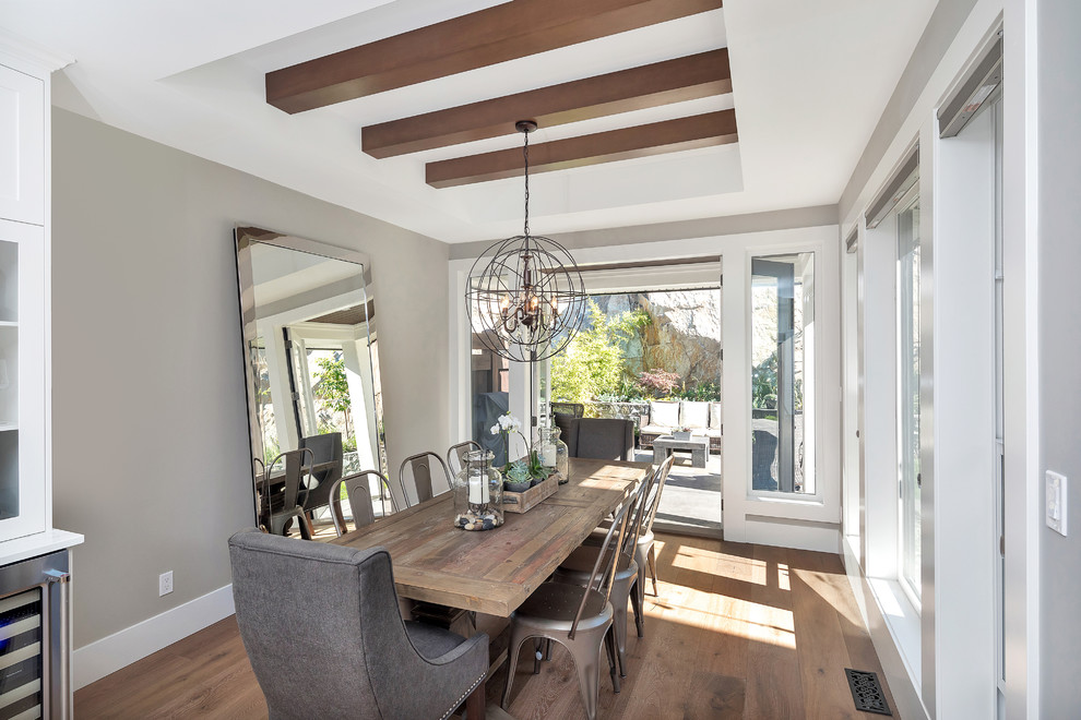 Transitional dining room in Other with grey walls, medium hardwood floors and brown floor.