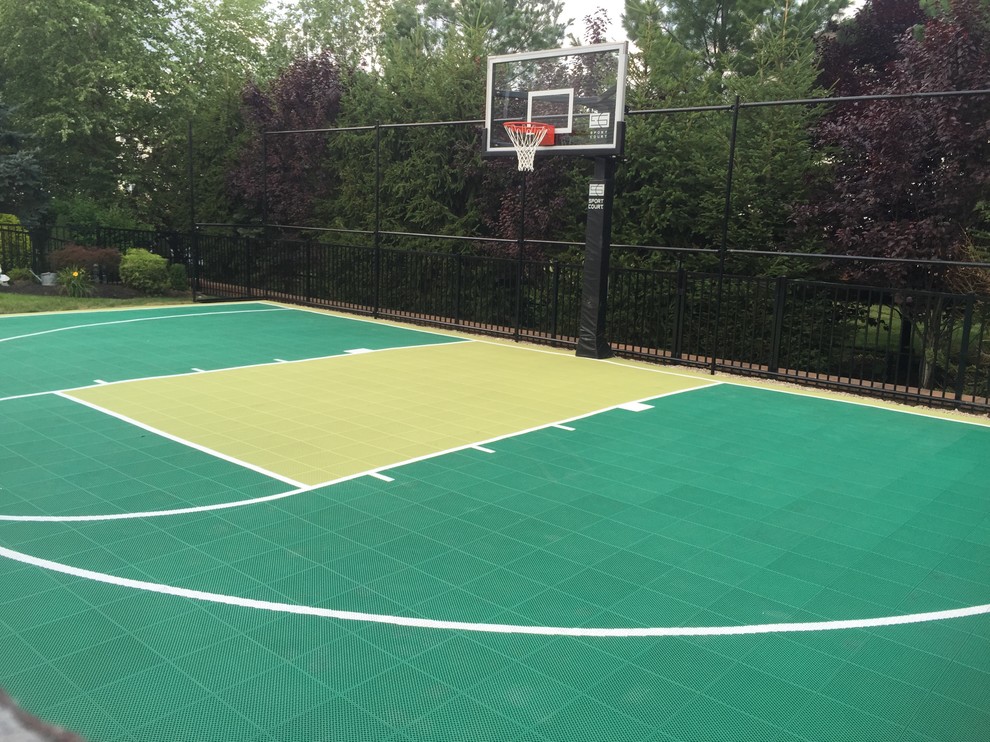 This is an example of a mid-sized modern backyard partial sun outdoor sport court in New York with with outdoor playset.