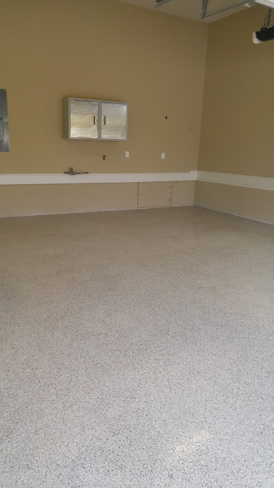 Inspiration for a mid-sized timeless attached two-car garage remodel