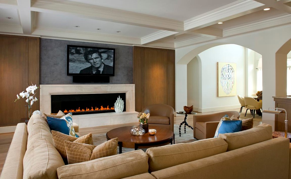 This is an example of a large traditional open concept living room in Dallas with beige walls, light hardwood floors, a ribbon fireplace, a stone fireplace surround and a wall-mounted tv.