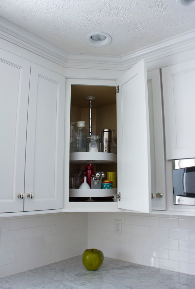Kitchen - transitional kitchen idea with shaker cabinets, white cabinets, marble countertops and white backsplash